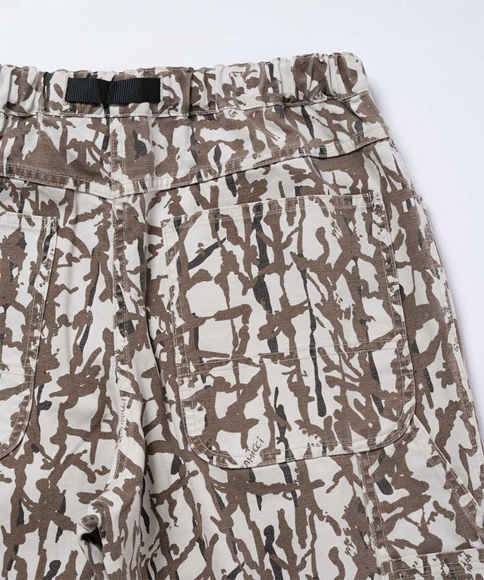 Back view close-up of grey reed camo Gramicci Taos Canvas Pant on a light-tone background.