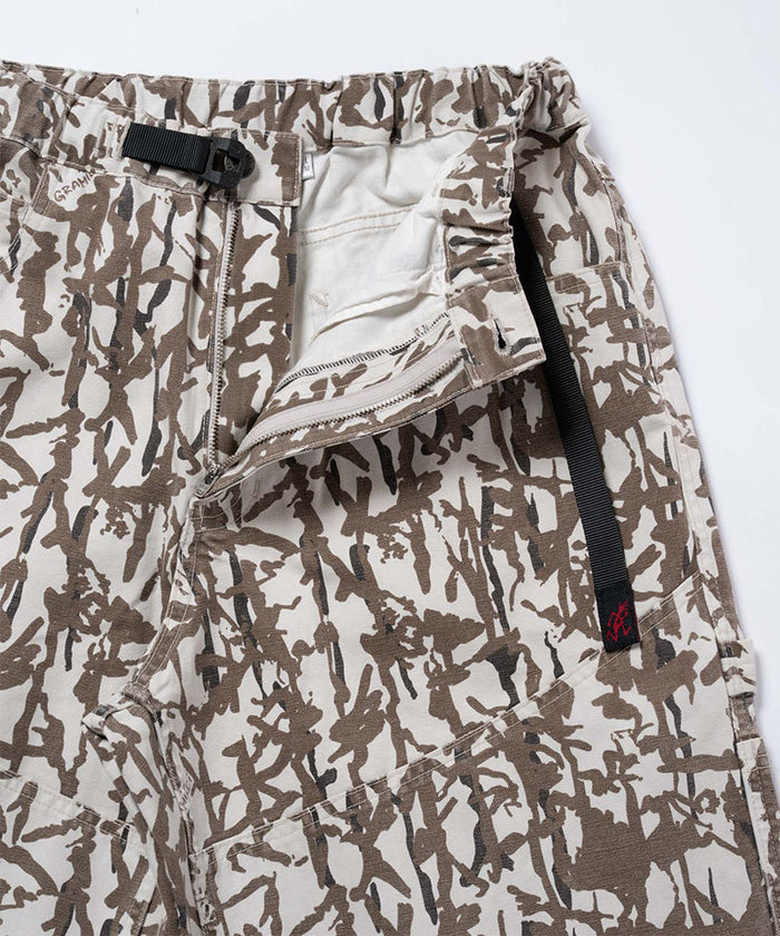 Close-up view of grey reed camo Gramicci Taos Canvas Pant on a light-tone background.