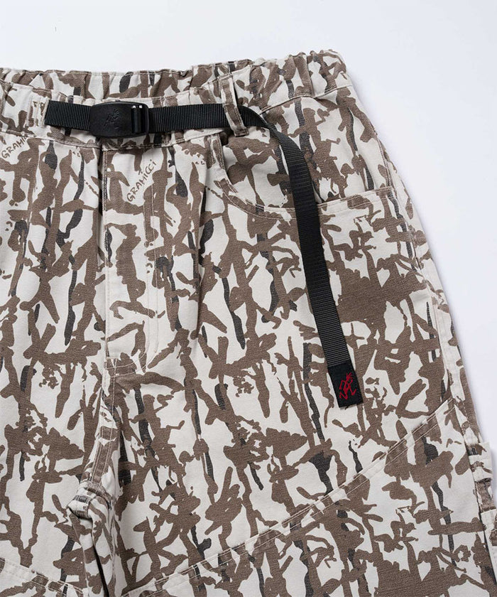 Close-up view of grey reed camo Gramicci Taos Canvas Pant on a light-tone background.