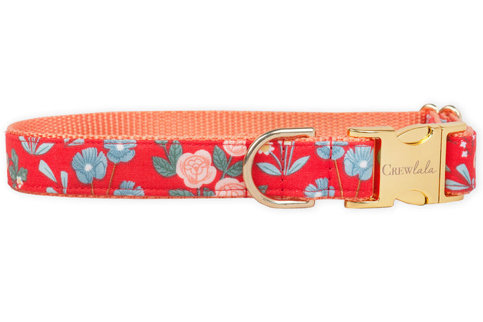 Floral and functional, this adjustable red dog collar features cheerful pastel blooms and greenery, a sturdy side-release buckle, and vibrant lining for all-day style and comfort.