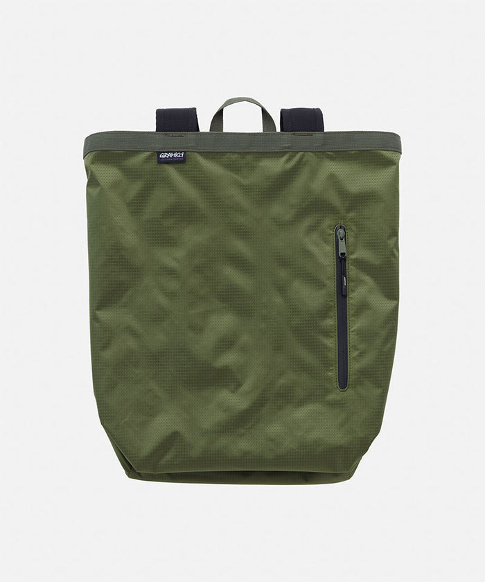Olive Gramicci Tote Pack bag against a light-tone background.