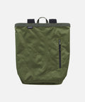 Olive Gramicci Tote Pack bag against a light-tone background.