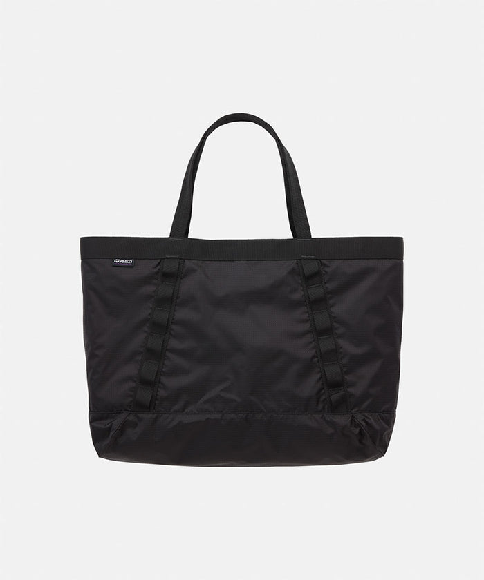 Black Gramicci Trail Tote bag on a light tone background