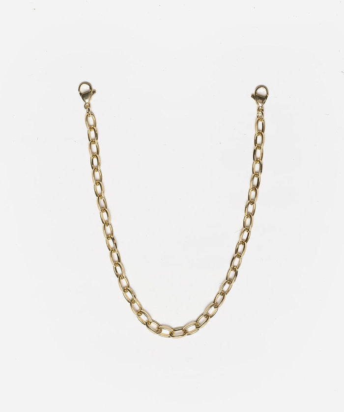 A gold trucker link chain band on a white background #color_gold
