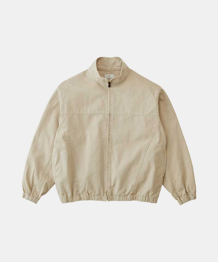 Gramicci chino colored Twill-Around Jacket against a light-tone background.
