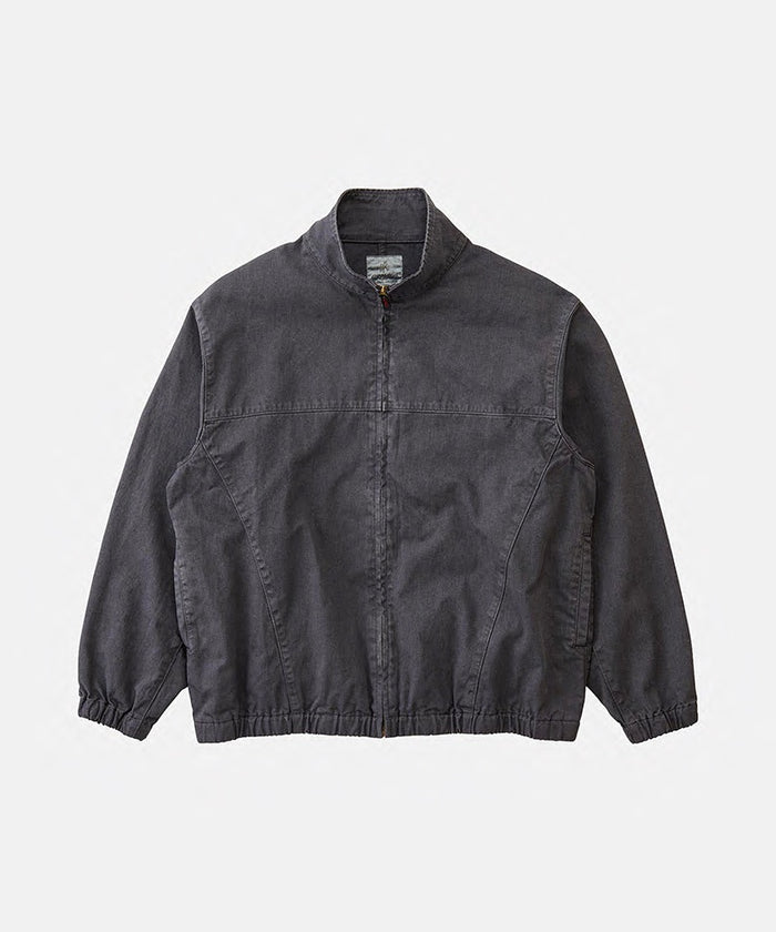 Gramicci fossil grey pigment Twill-Around Jacket against a light-tone background.