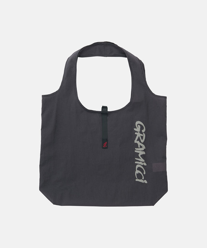 Midnight grey Gramicci reuseable Ultra-Light Shopper against a light-tone background.
