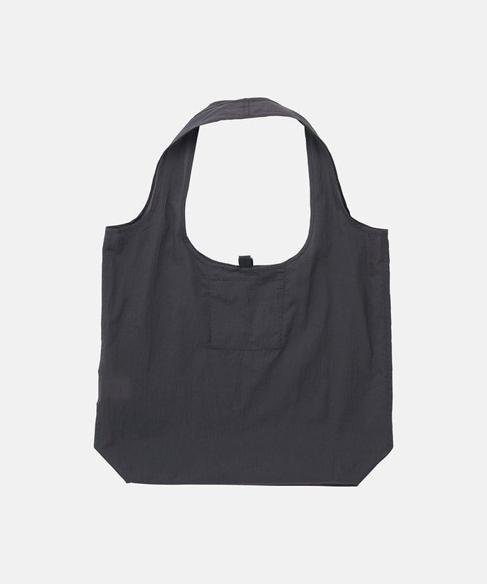 Midnight grey Gramicci reuseable Ultra-Light Shopper against a light-tone background.