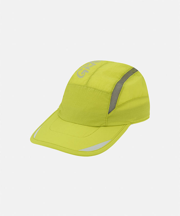Kiwi green Gramicci Ultra-Light Tech Cap against a light-tone background.