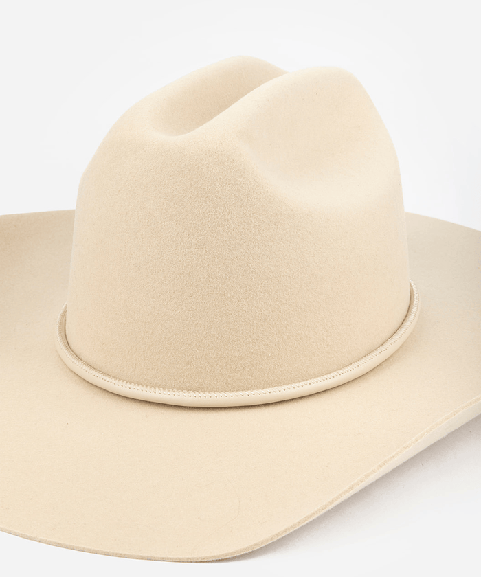 Beige cowboy hat on a white background #color_cream