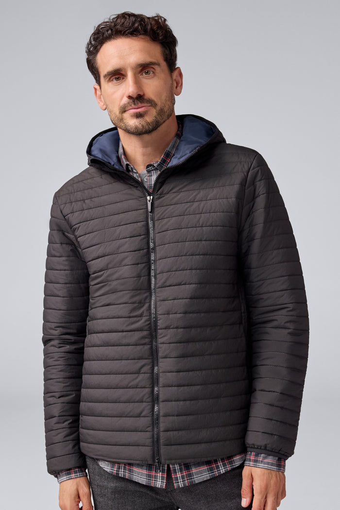 Front view of a man wearing Warmknit Air Jacket in True Black/Total Eclipse Liner