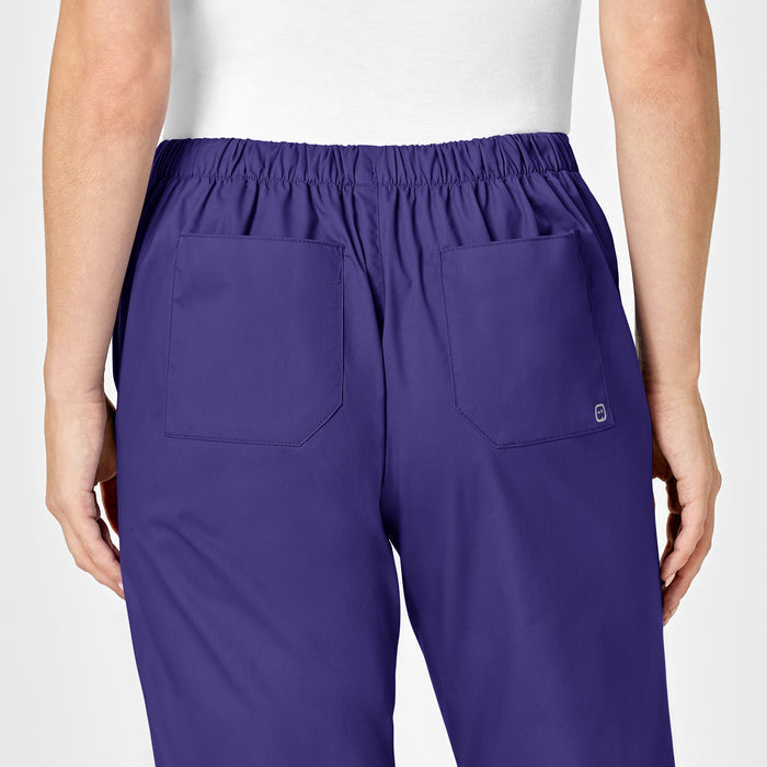 WonderWORK Women's Flare Leg Scrub Pant Grape hemline detail