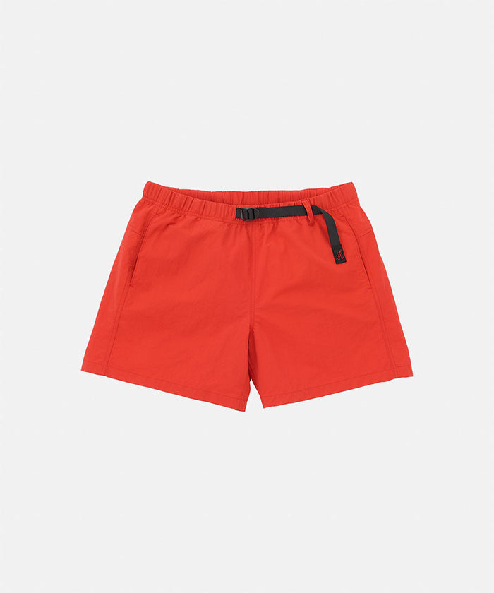 Burnt orange Gramicci Women's Nylon Active Short with a black belt against a light-tone background.
