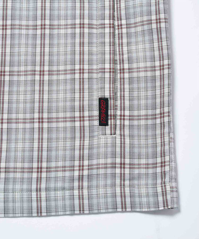 Gramicci natural shadow plaid Zip-Up Garage Jacket hem detail against a light-tone background.