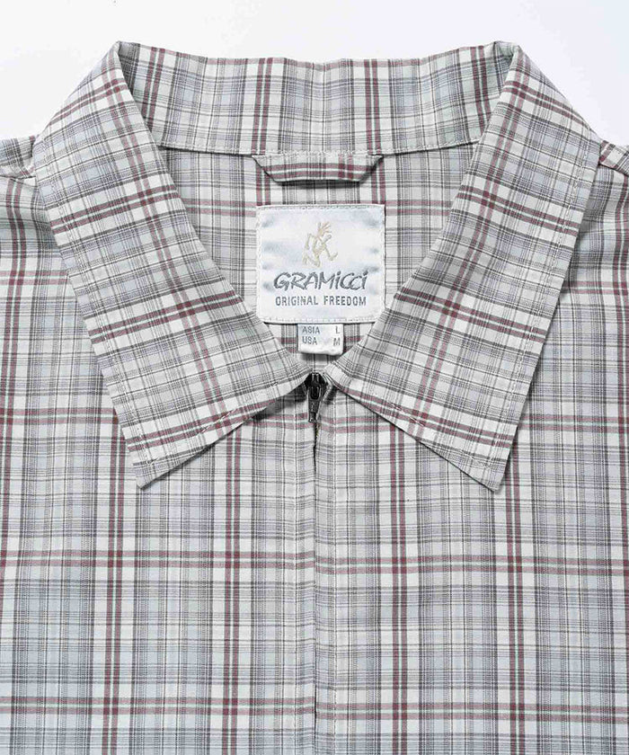 Gramicci natural shadow plaid Zip-Up Garage Jacket collar detail against a light-tone background.